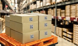 Smart logistic industry 4.0 , QR Codes Asset warehouse and inventory management supply chain technology concept. Group of boxes in storehouse can check product inside and order pick time.